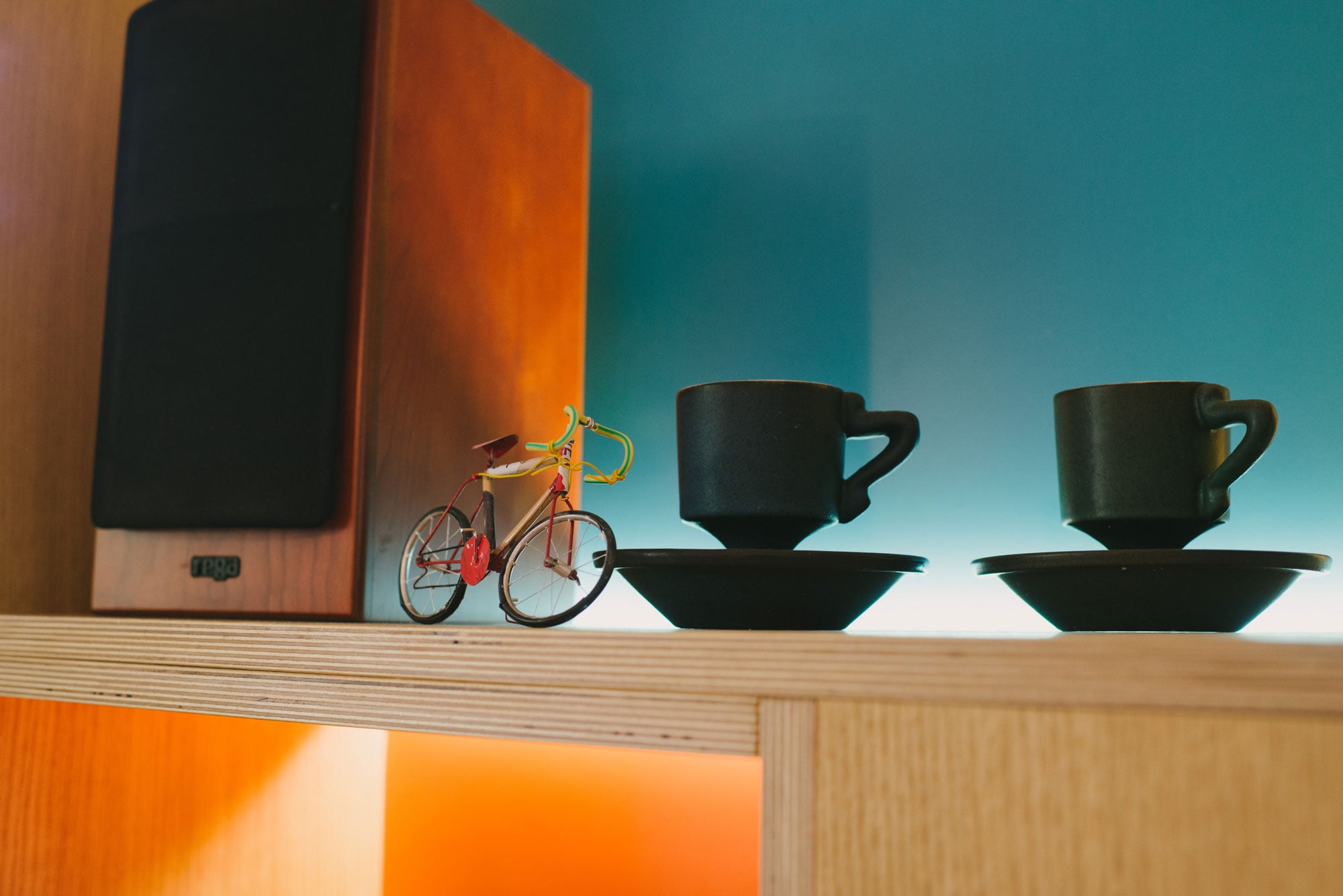 blue and orange plywood kitchen - shelving