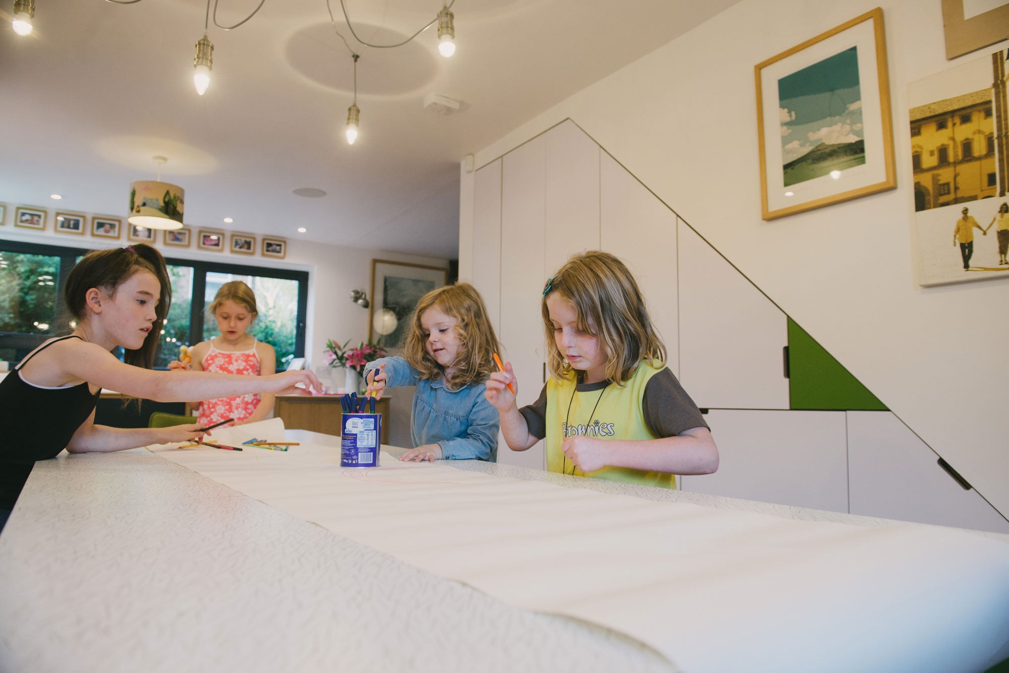 Children colouring in at the kitchen table