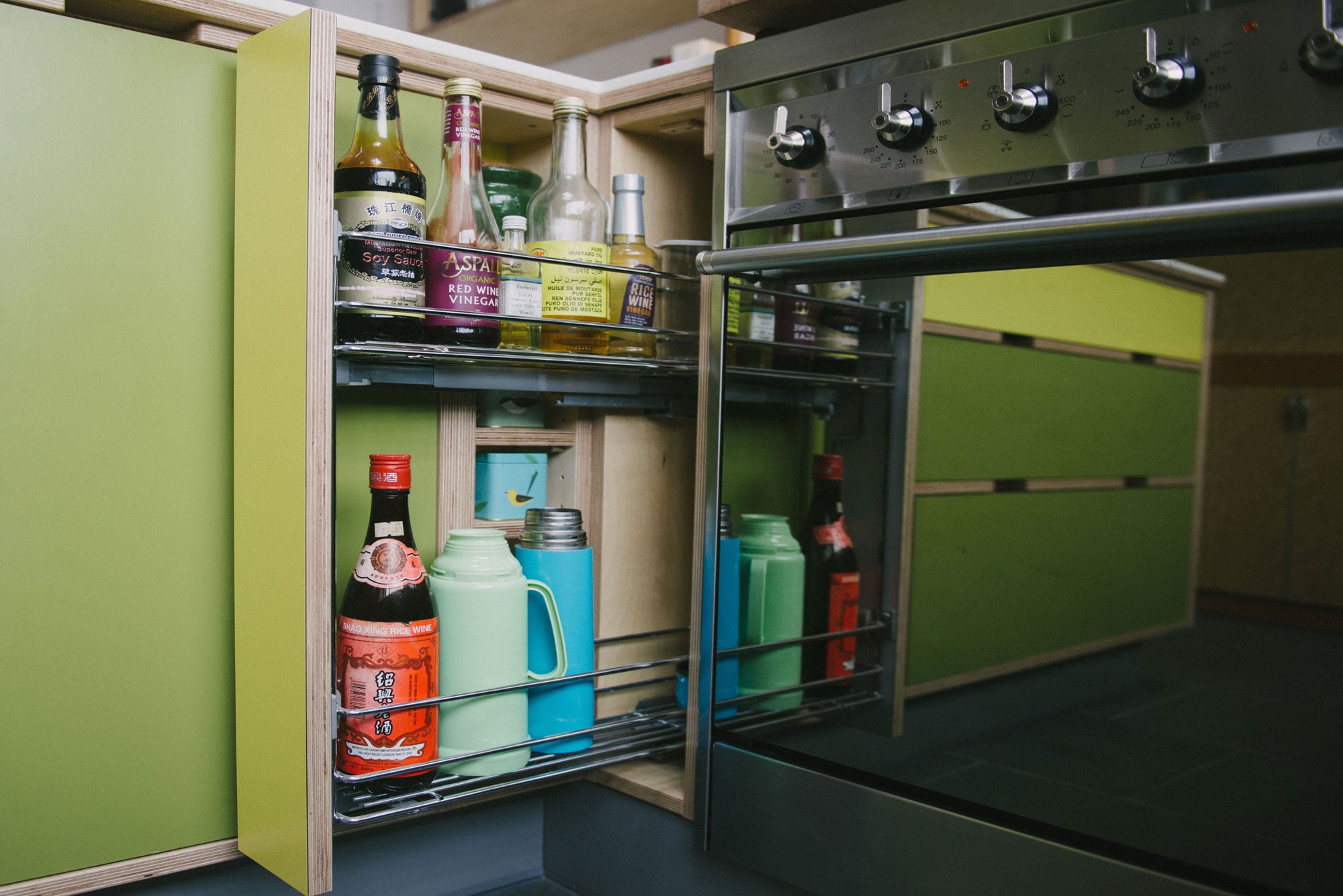 Green & yellow plywood kitchen pull out larder
