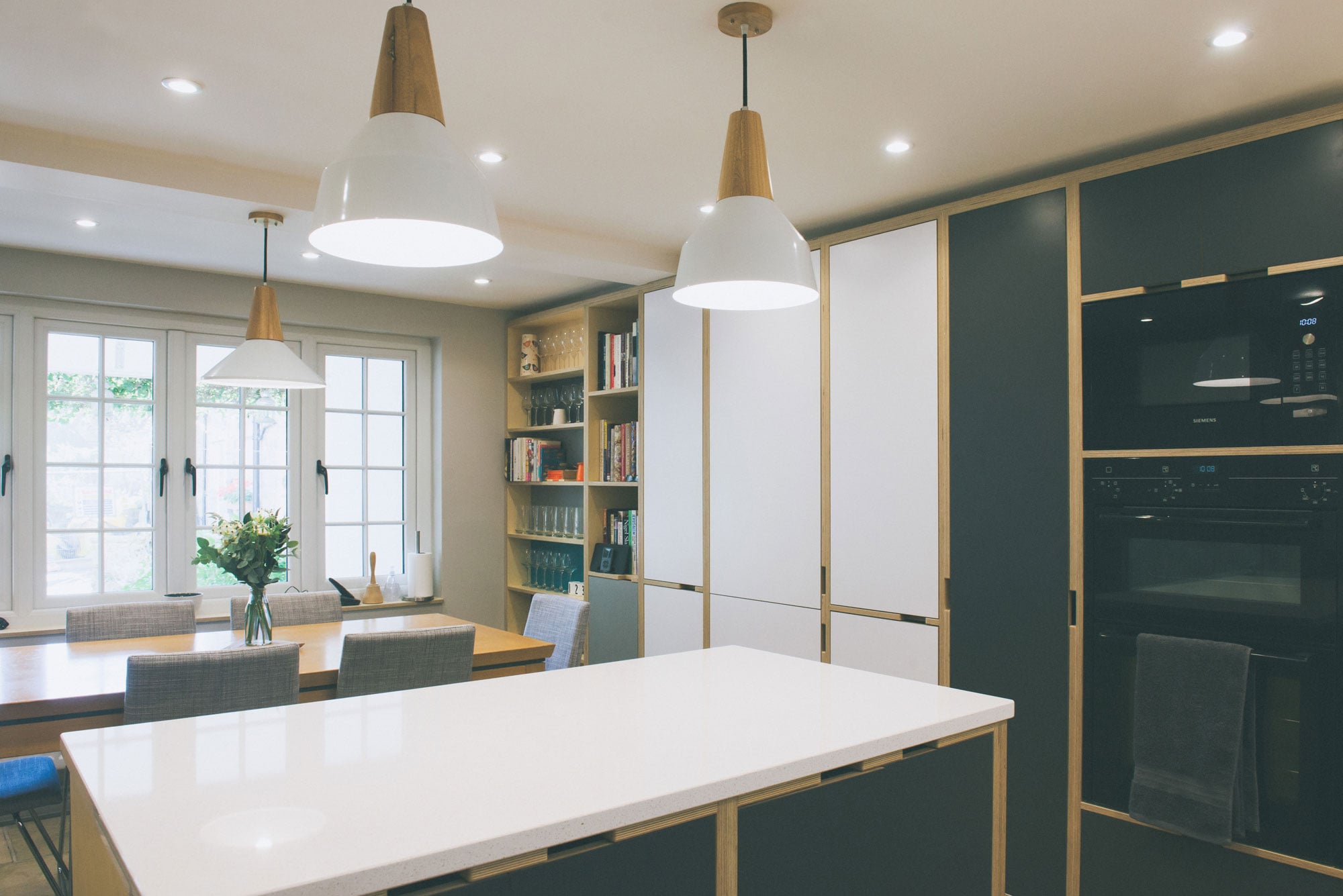 Open plan plywood kitchen diner