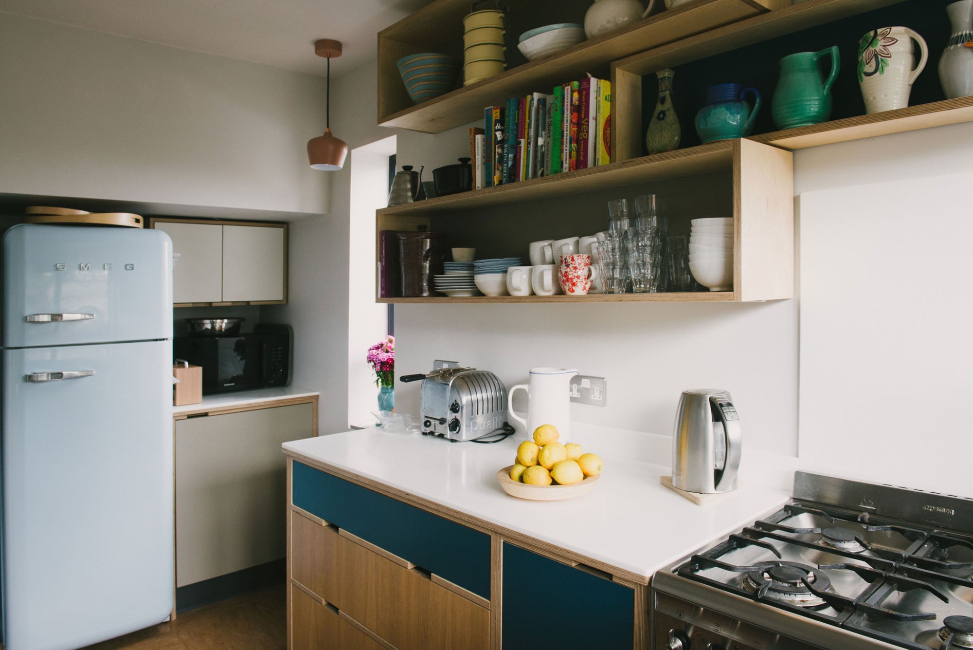 Navy and Oak plywood kitchen - Blue Smeg fridge