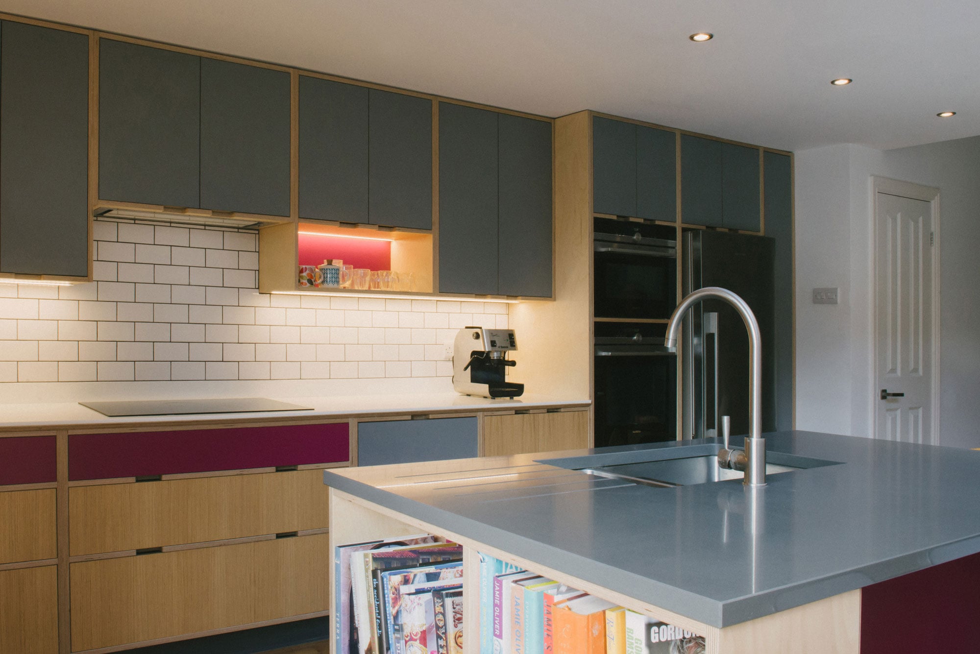 Cooking Area of Pink and Grey Plywood Kitchen