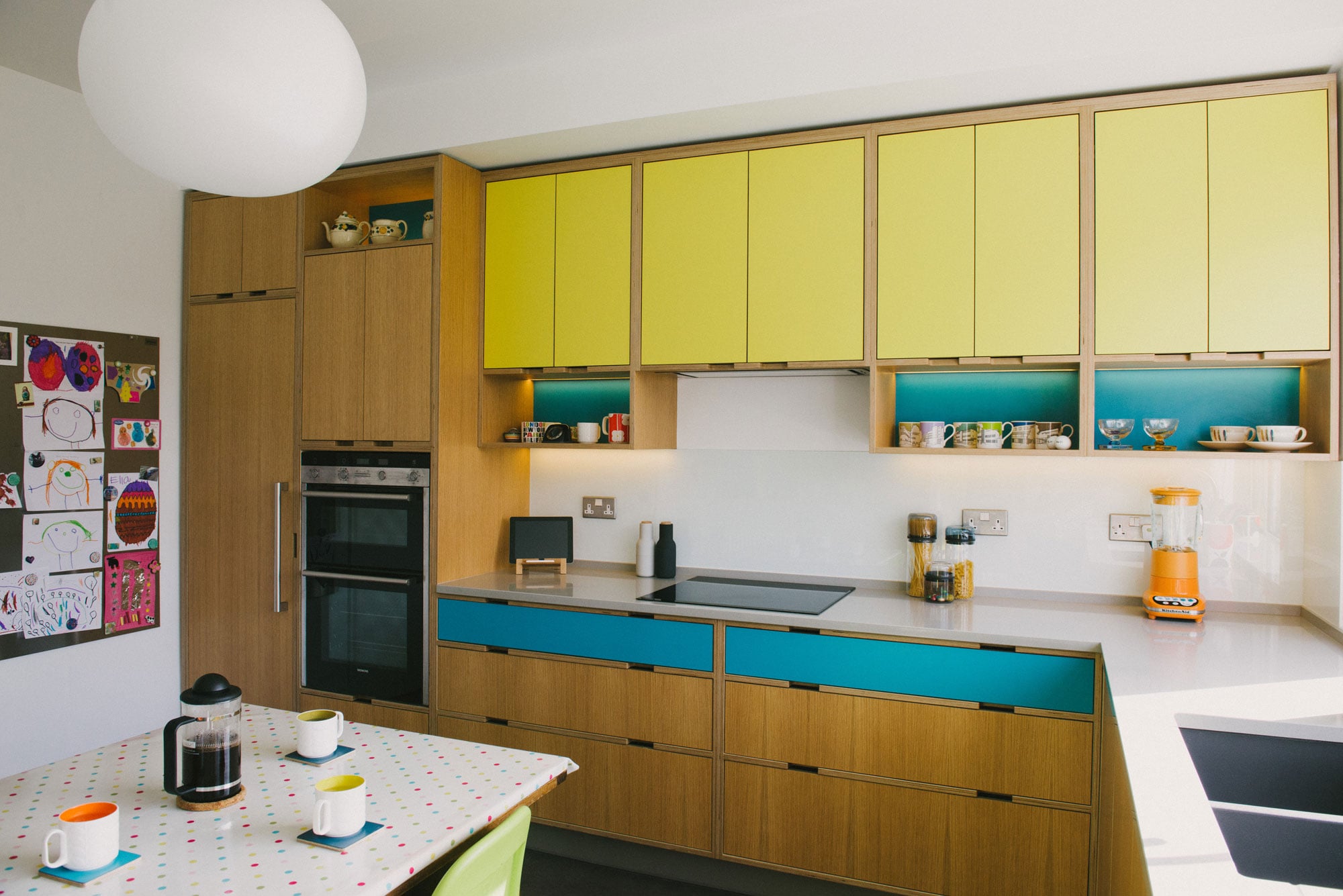 yellow and blue plywood kitchen