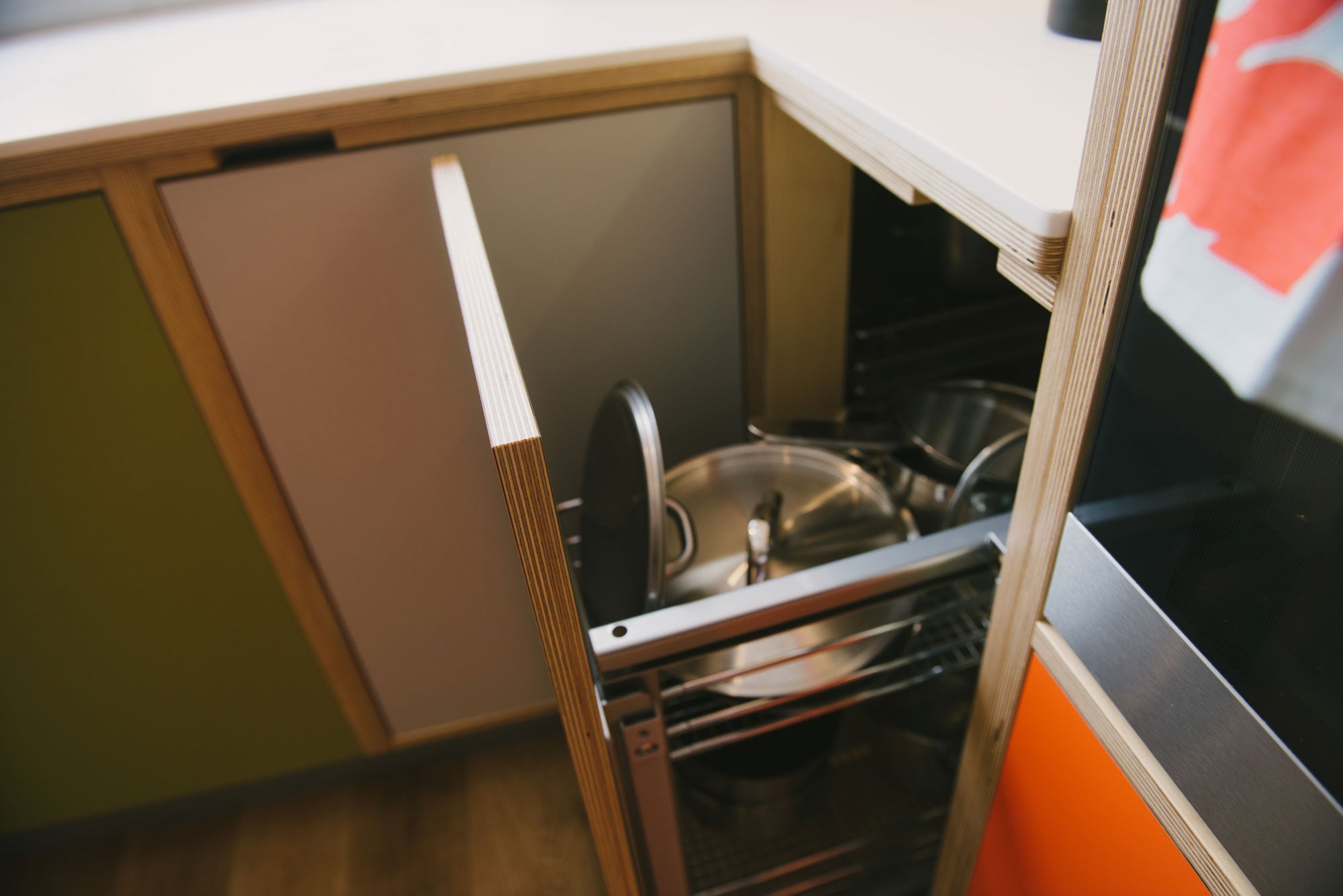 Orange and green kitchen corner cupboard