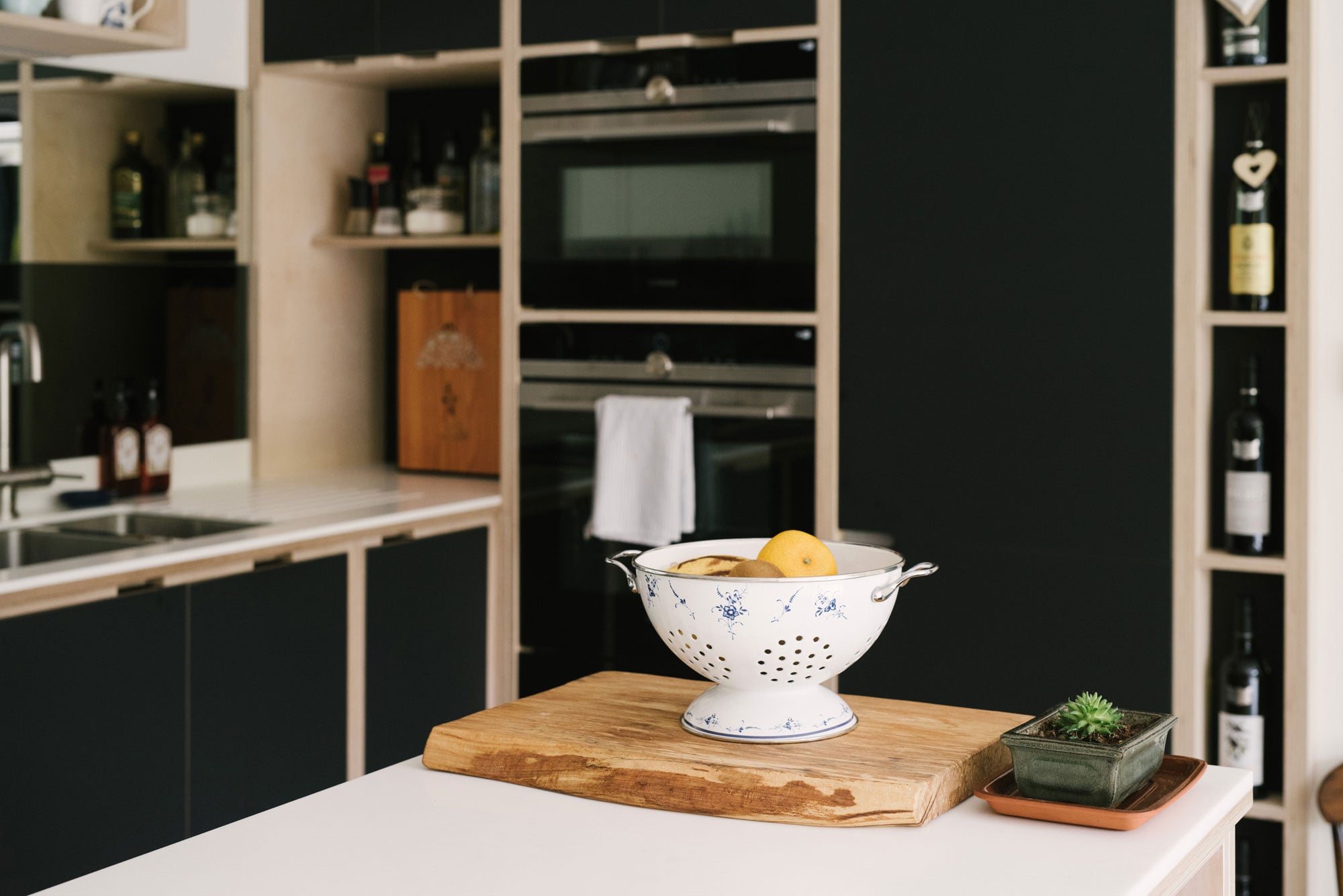 Kitchen With Mirror Splash Back - Colander of Lemons