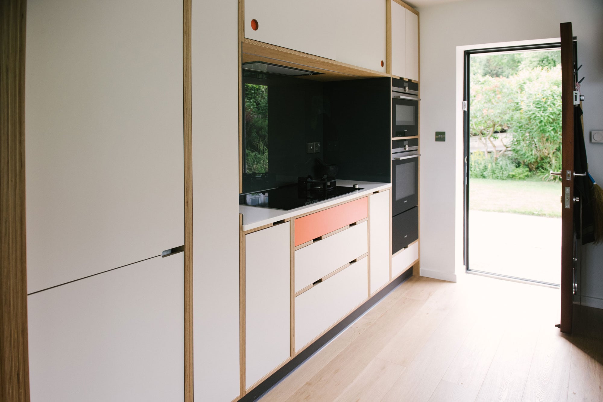 Mid Century Style Plywood Kitchen - White and Orange Kitchen