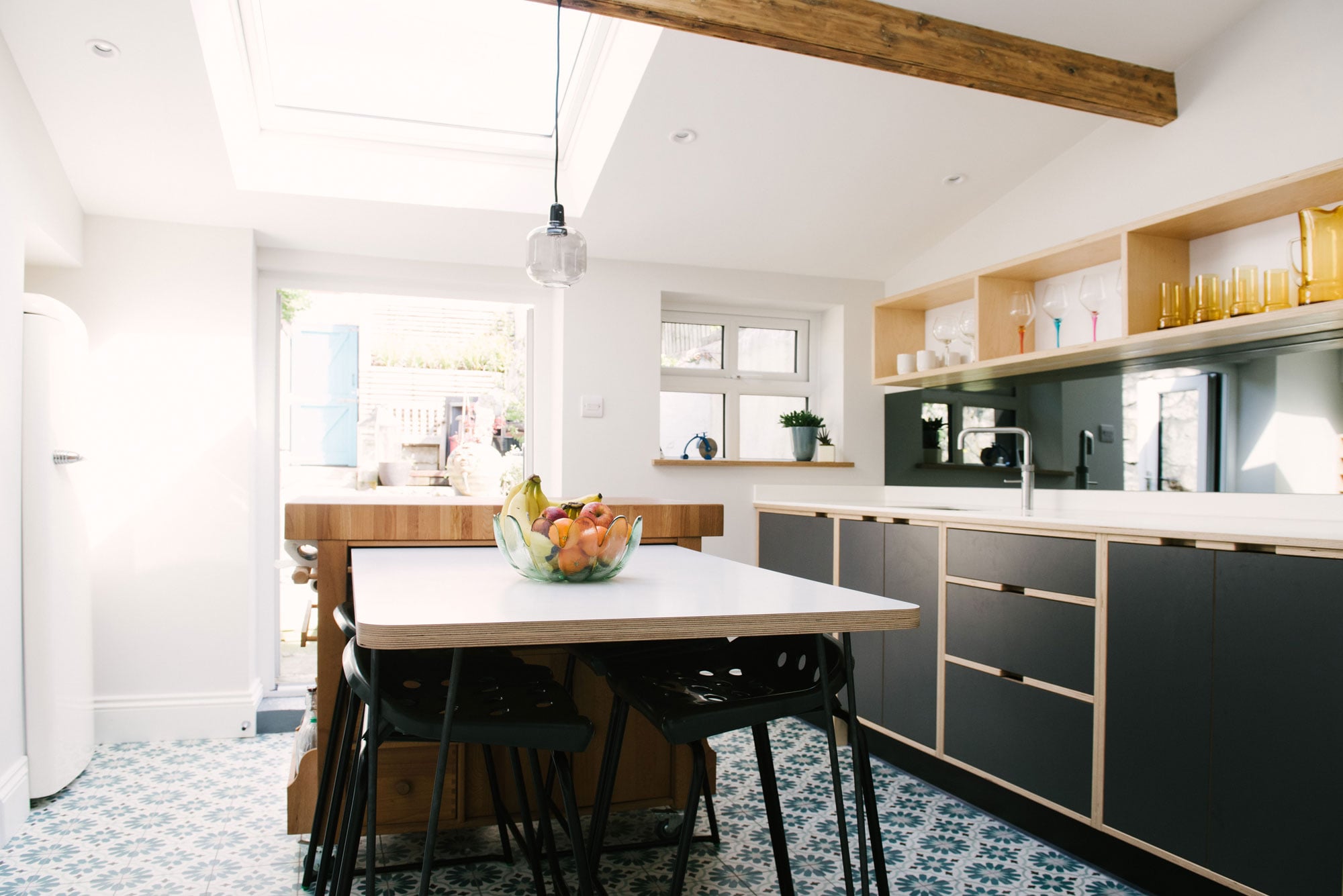 Monochrome plywood kitchen diner