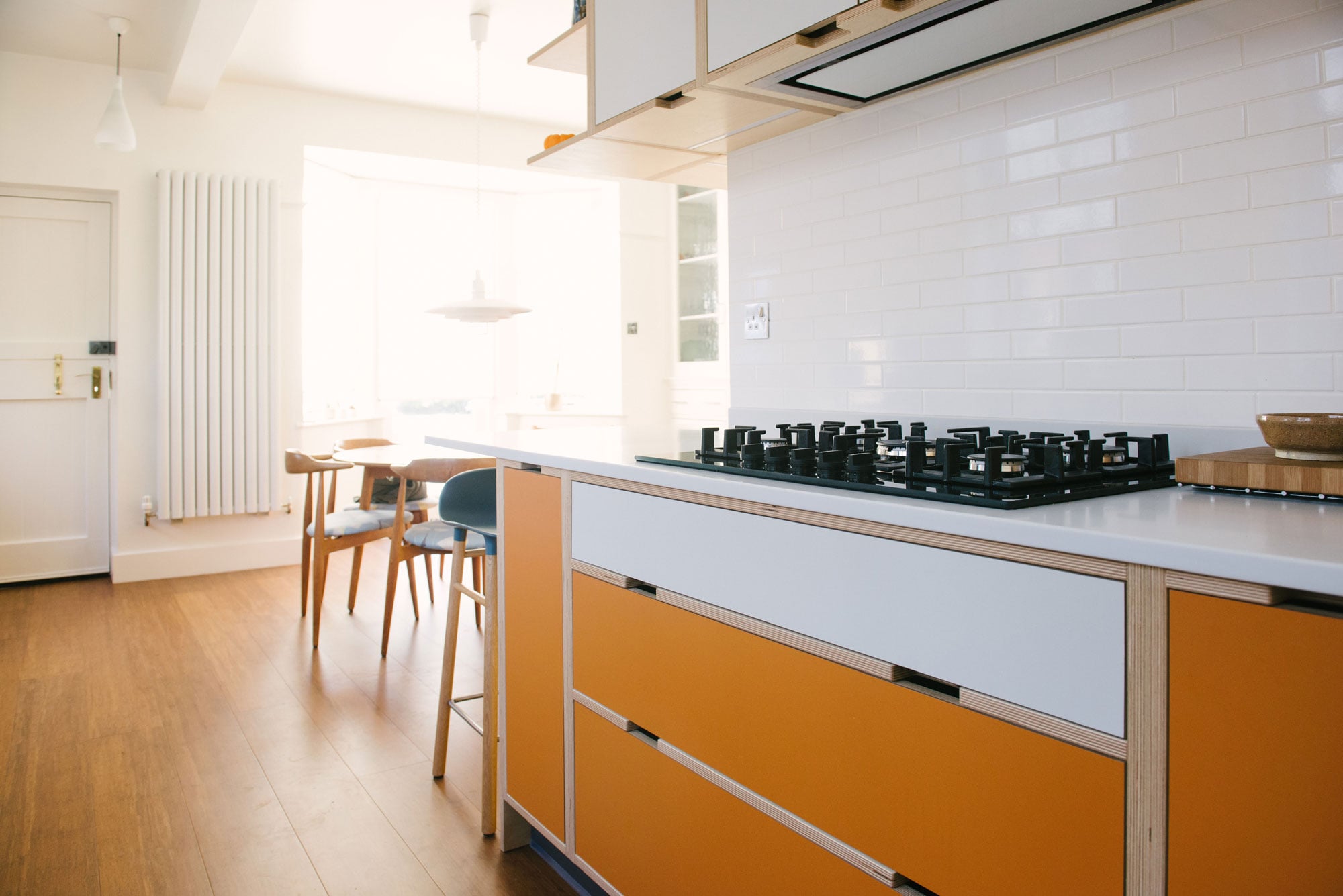 Hob in Orange and White Laminated Plywood Kitchen