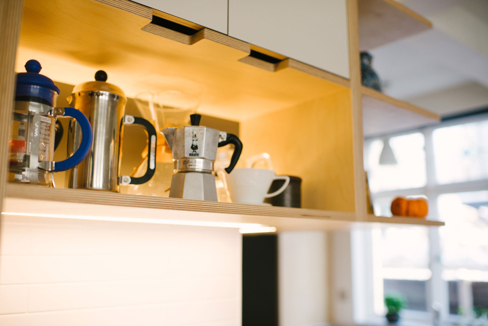 Open Shelving of Orange and White Laminated Plywood Kitchen