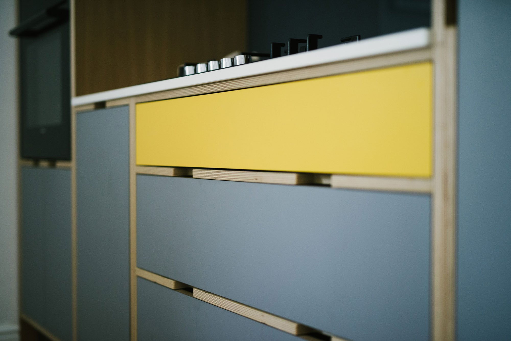 Grey and Yellow Plywood Kitchen Drawers