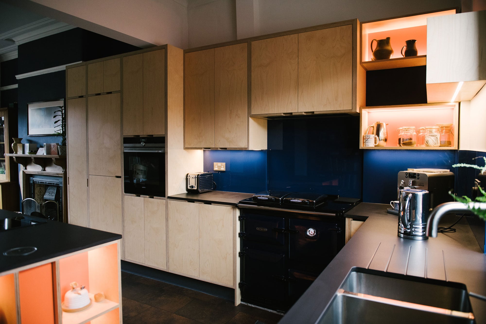Birch Plywood Kitchen With Navy Glass Splashback