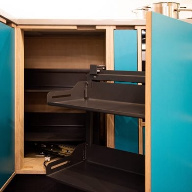 Corner pull out system for kitchen cupboard 