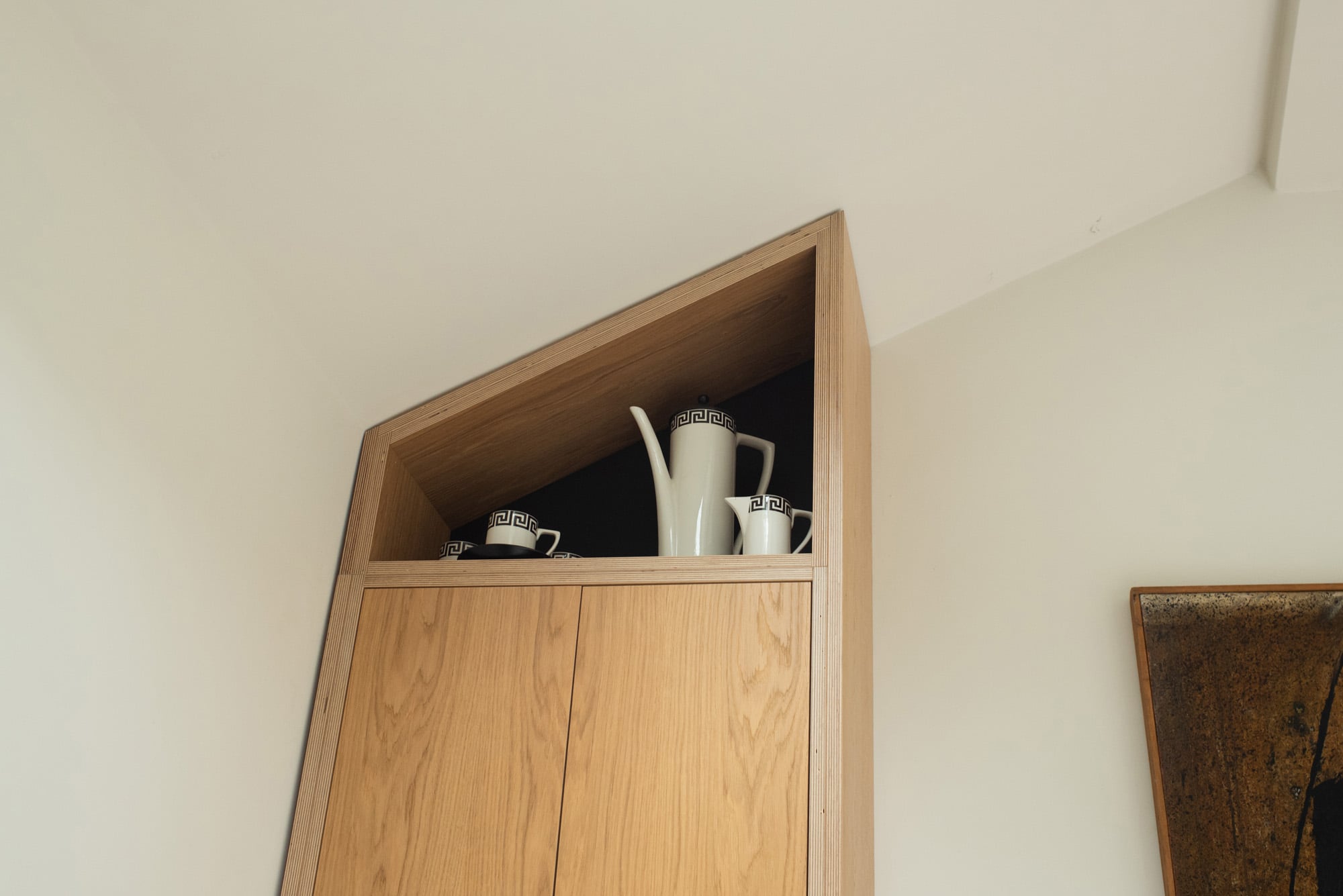 Angled cabinet to fit ceiling 