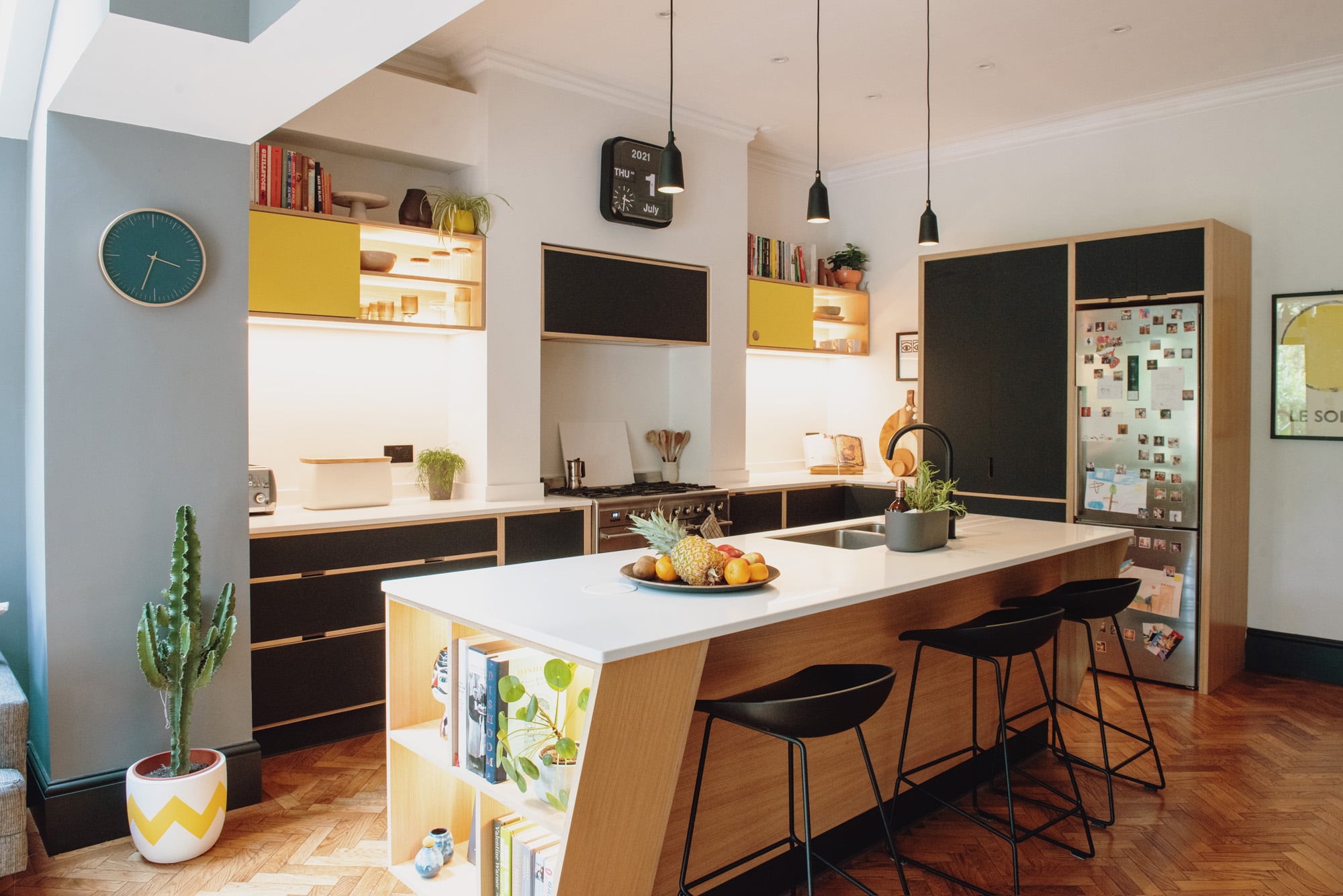 black and yellow plywood kitchen with illuminated units 