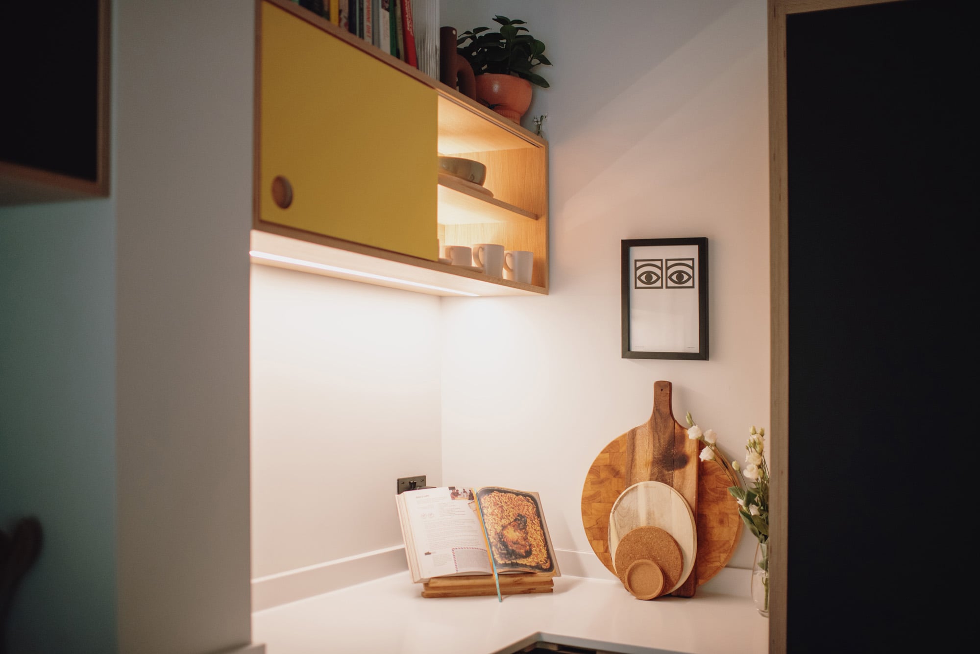 close up of illuminated yellow plywood wall unit 