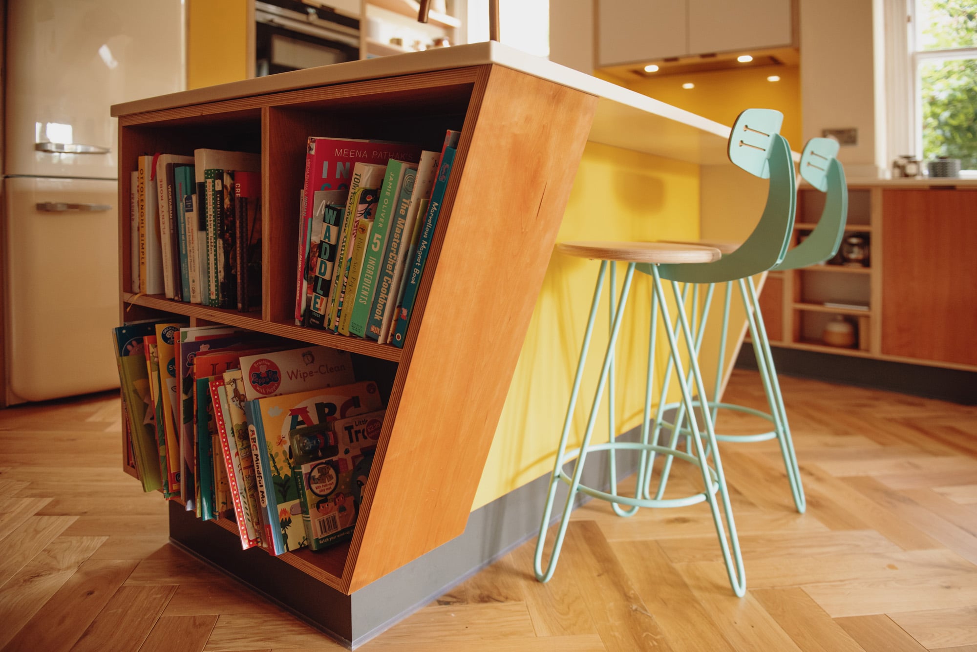 cherry kitchen island with pale blue bar chairs