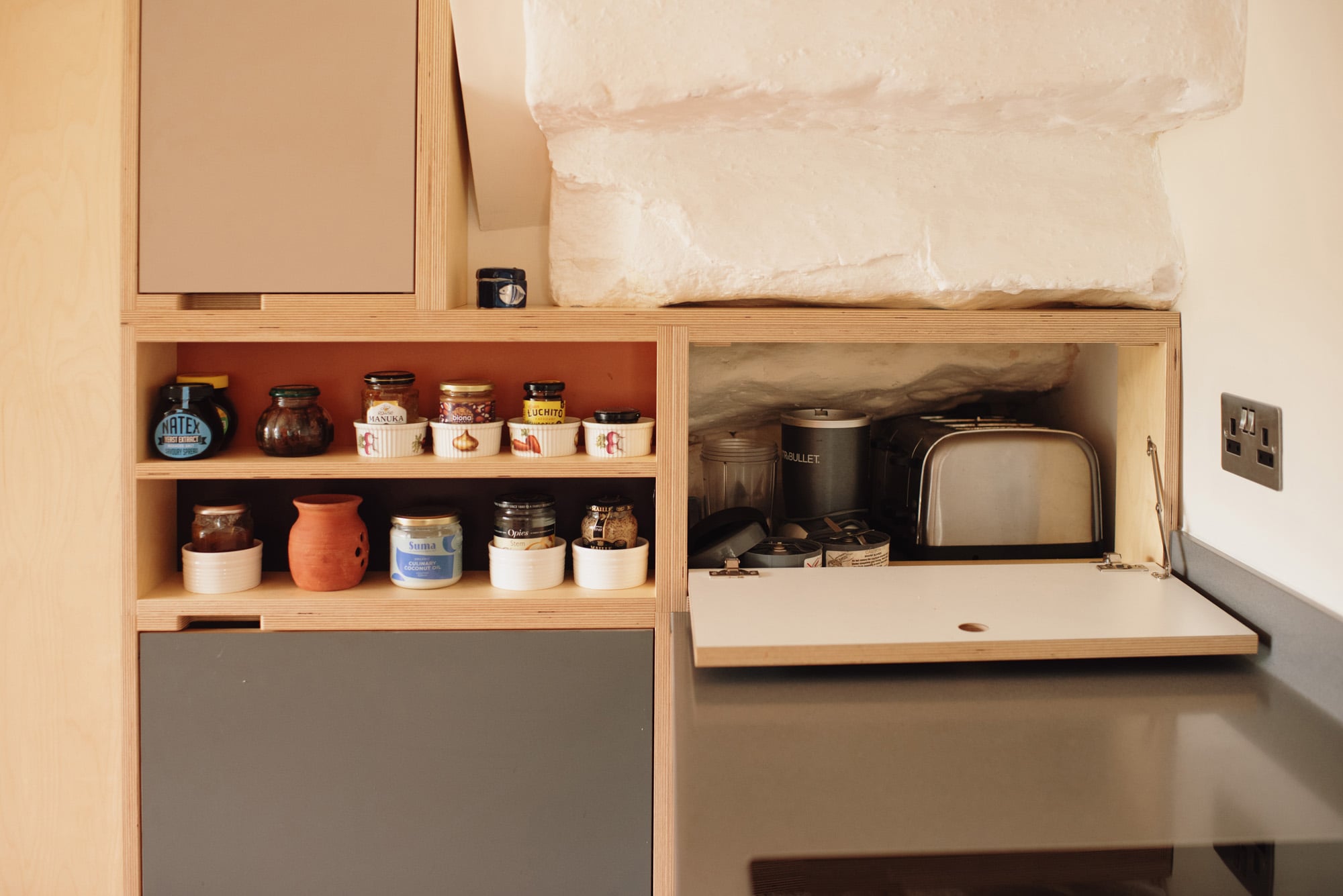 under stairs storage of bespoke kitchen