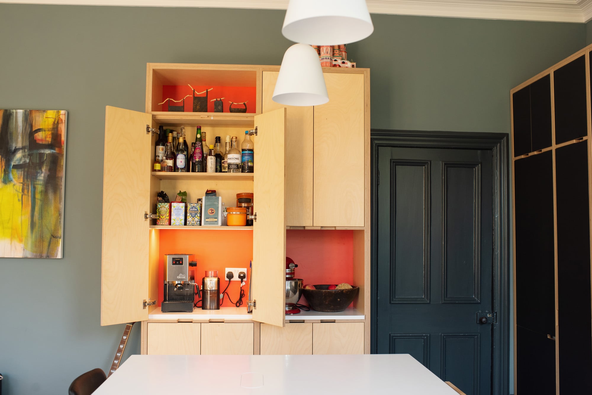 Tall kitchen cabinets with doors open 