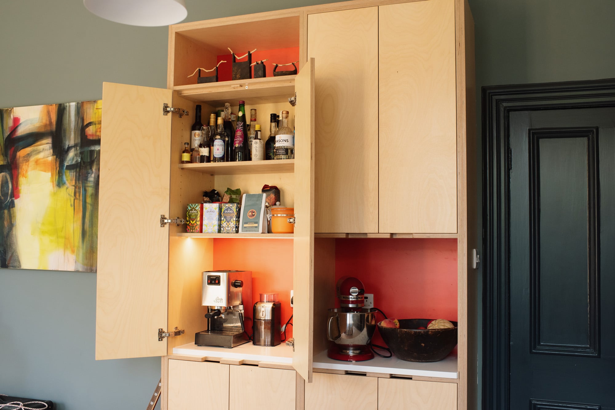 close up of tall kitchen cabinets with doors open