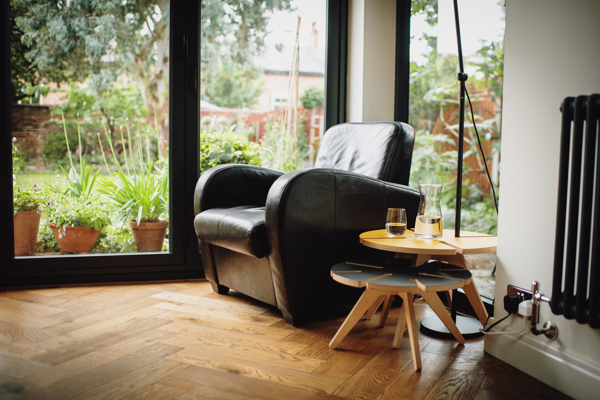 Leather Chair with plywood table in front of window