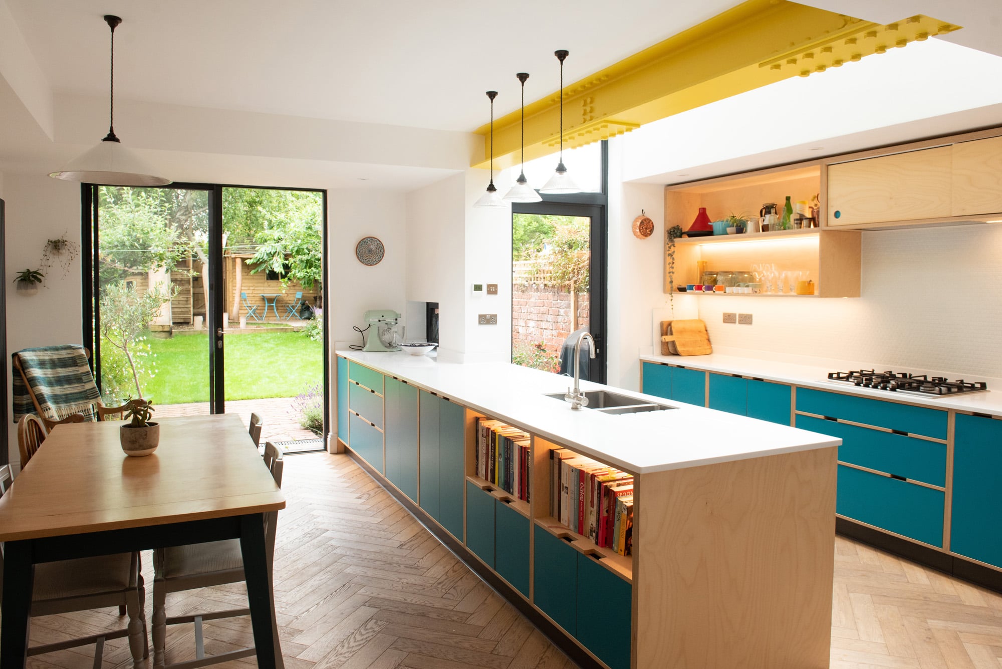 kitchen diner extension with blue plywood kitchen