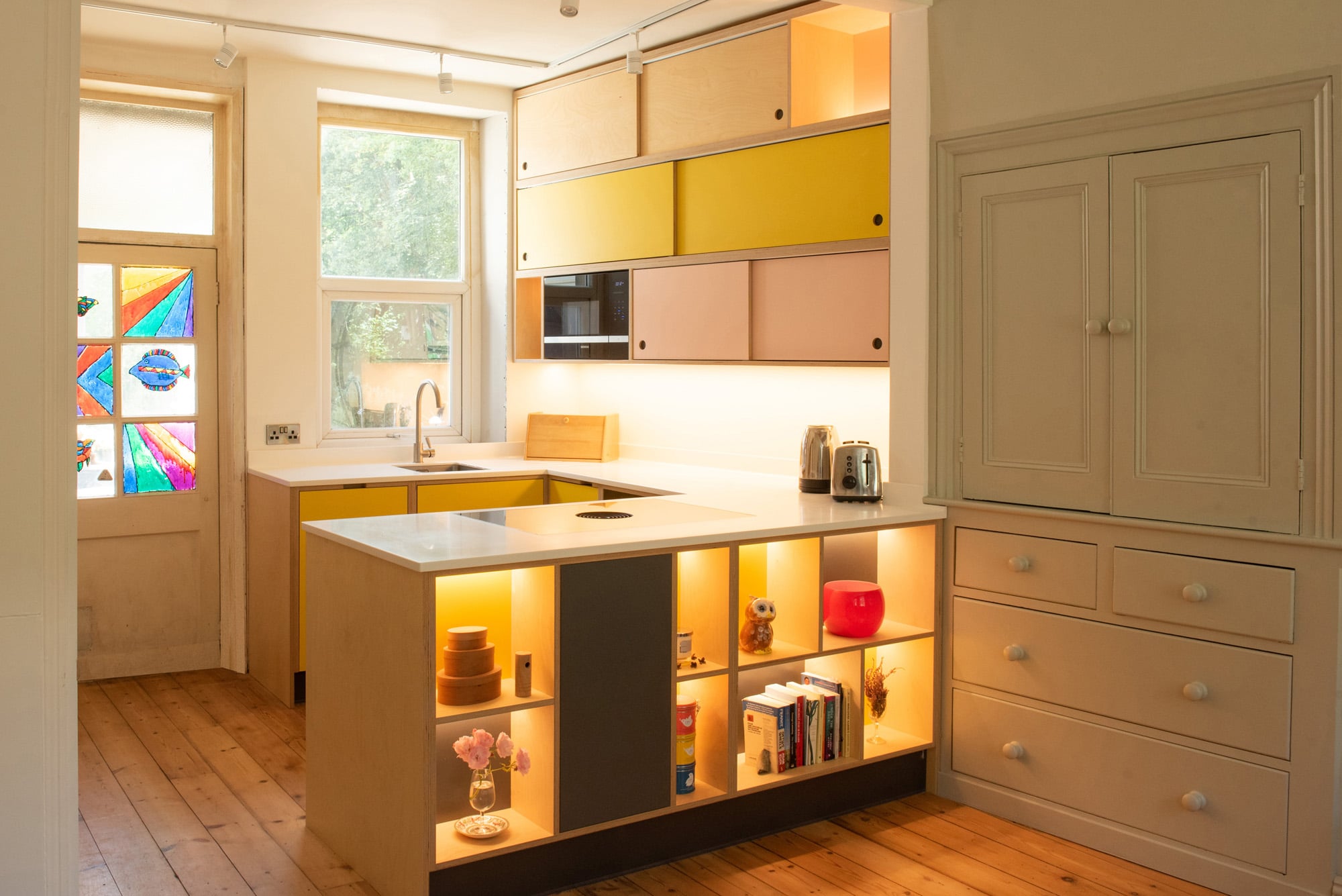 unusual kitchen in yellow and pink