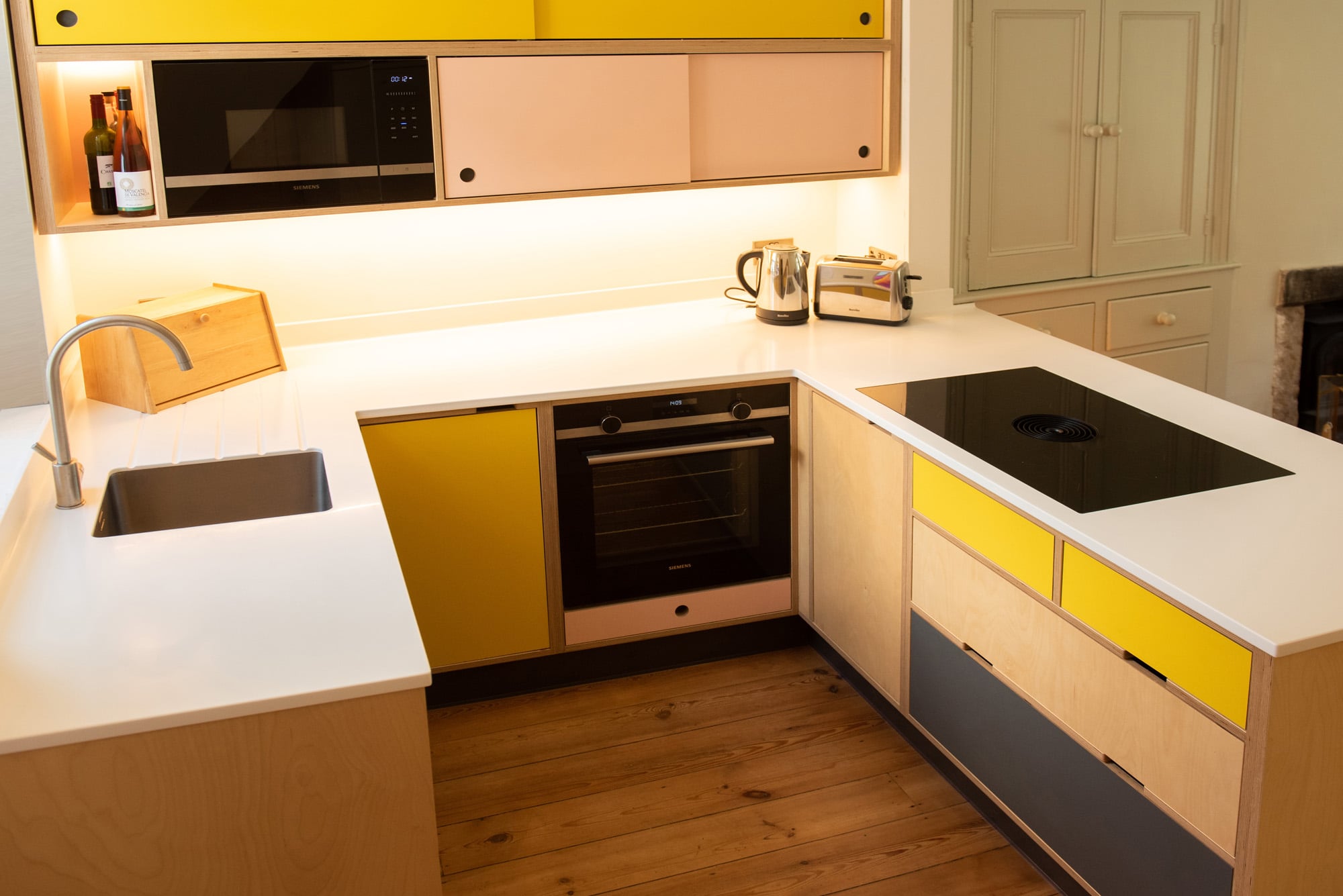 alternative kitchen in yellow and pink overhead view 