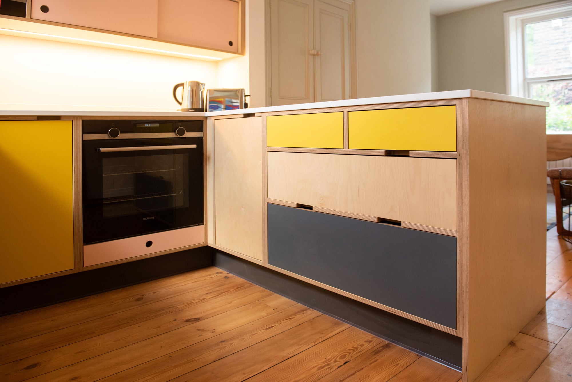 yellow and pink alternative kitchen 
