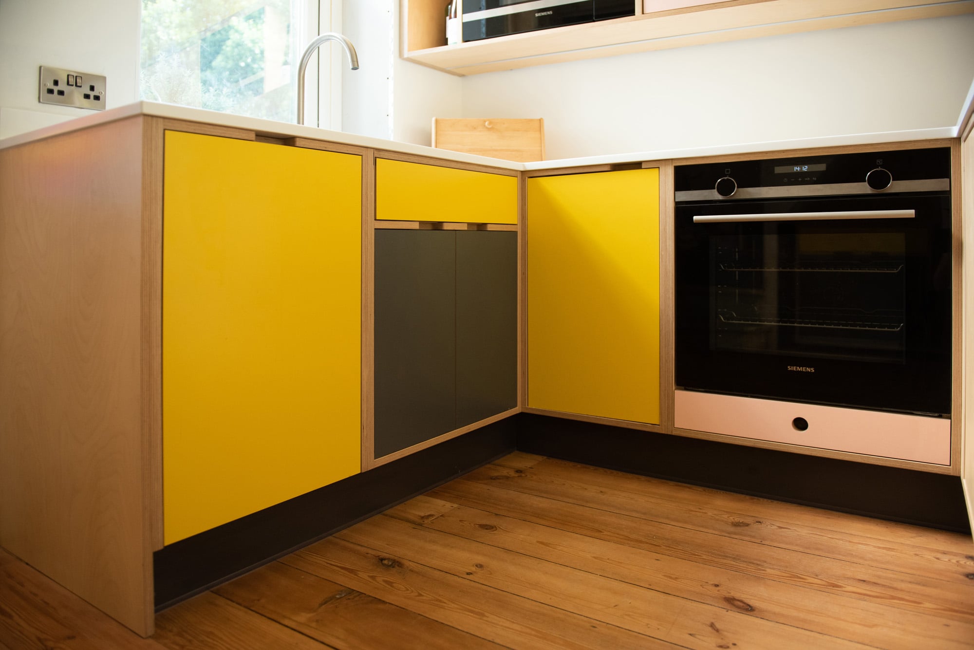 yellow and pink handmade kitchen hob and sink