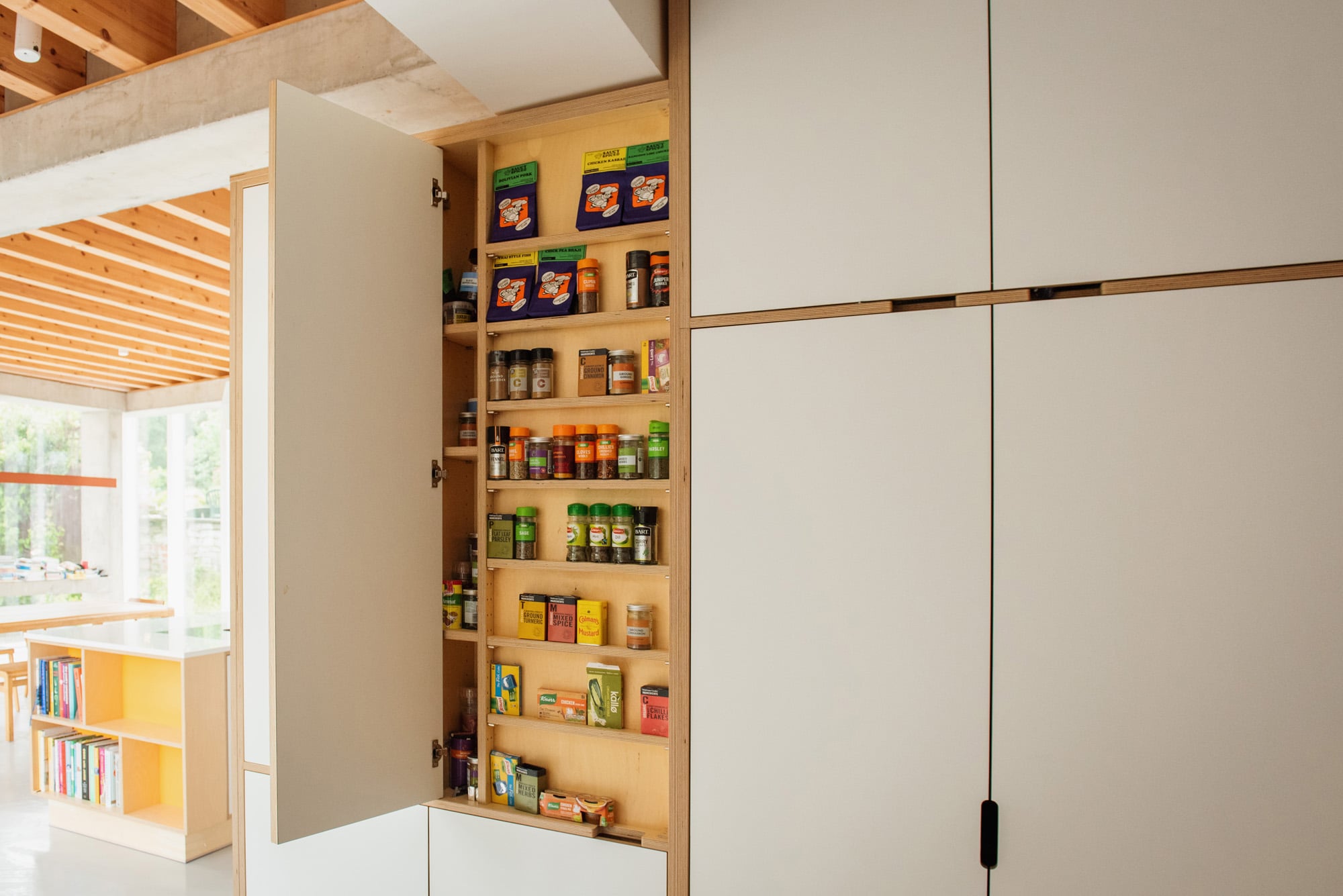 spice rack in white plywood kitchen 
