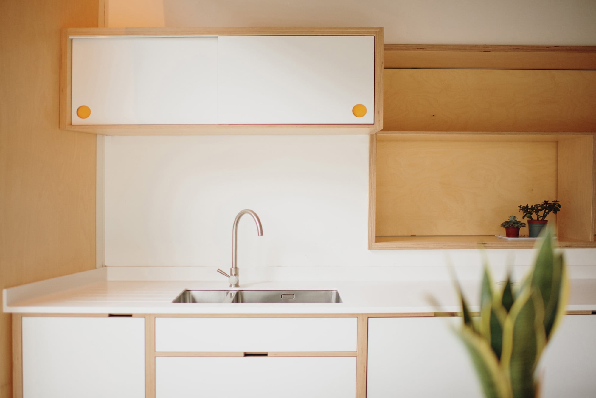 sink area in white plywood kitchen 