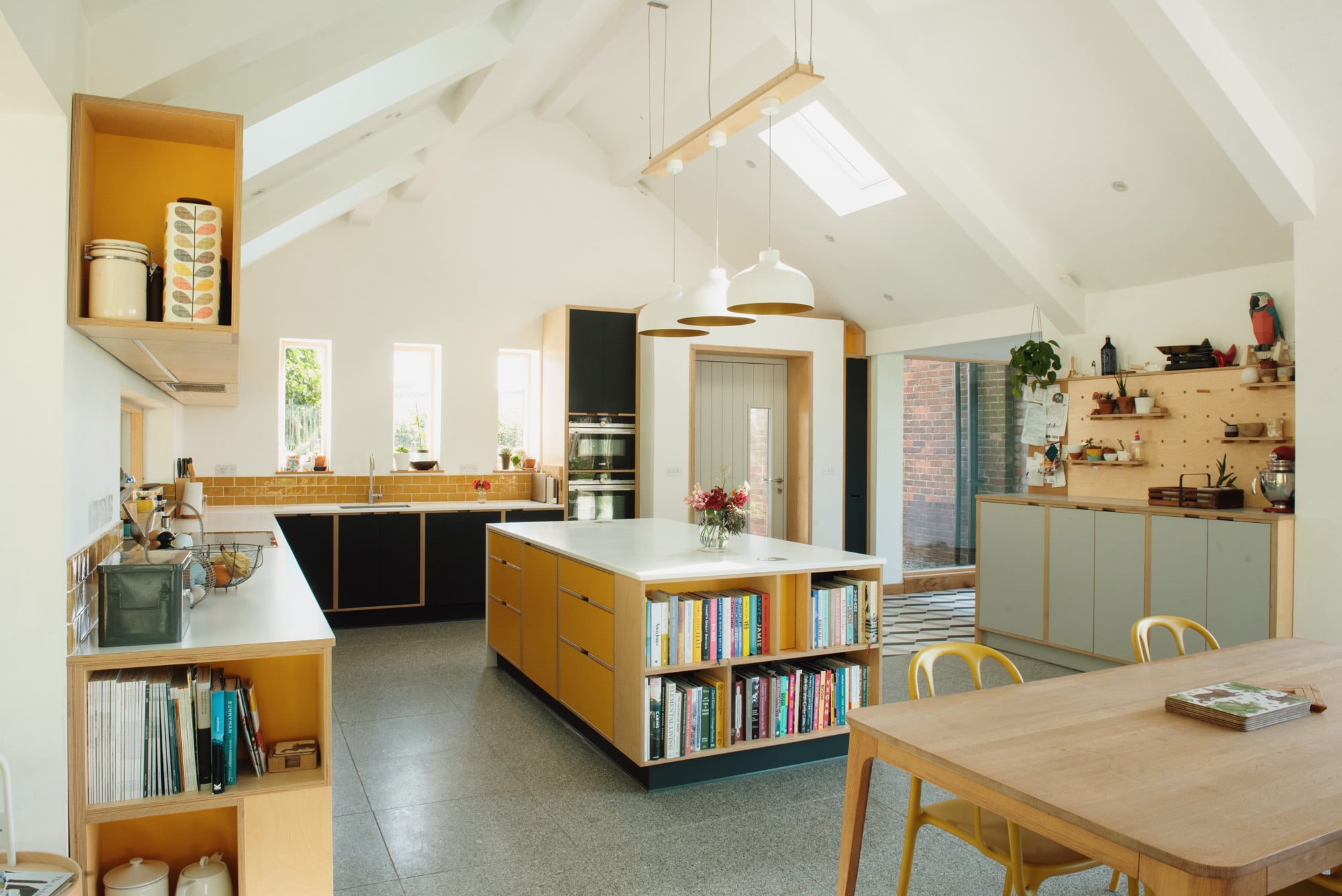 room shot showing modern plywood kitchen with island unit