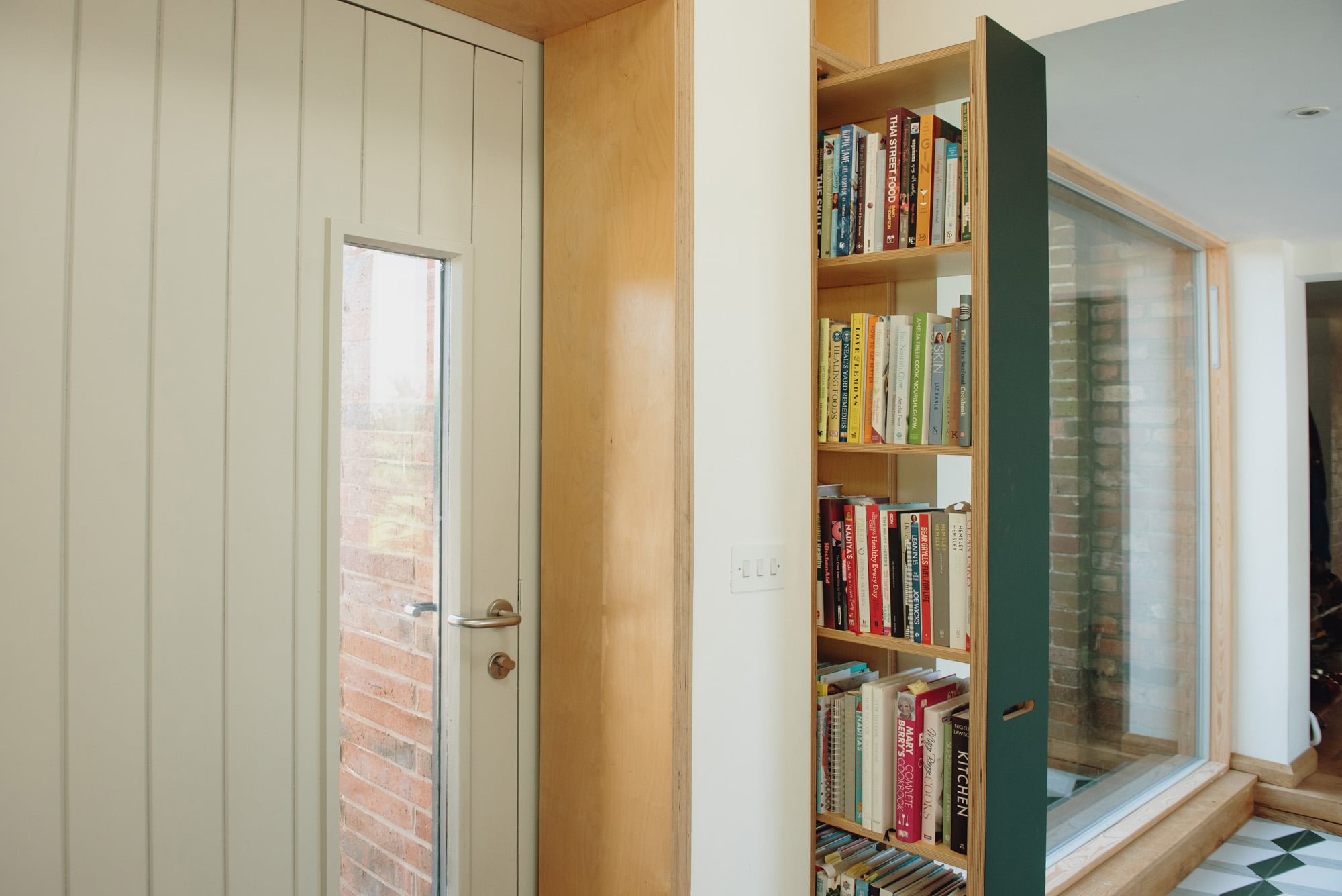 Pull out plywood bookcase in open position