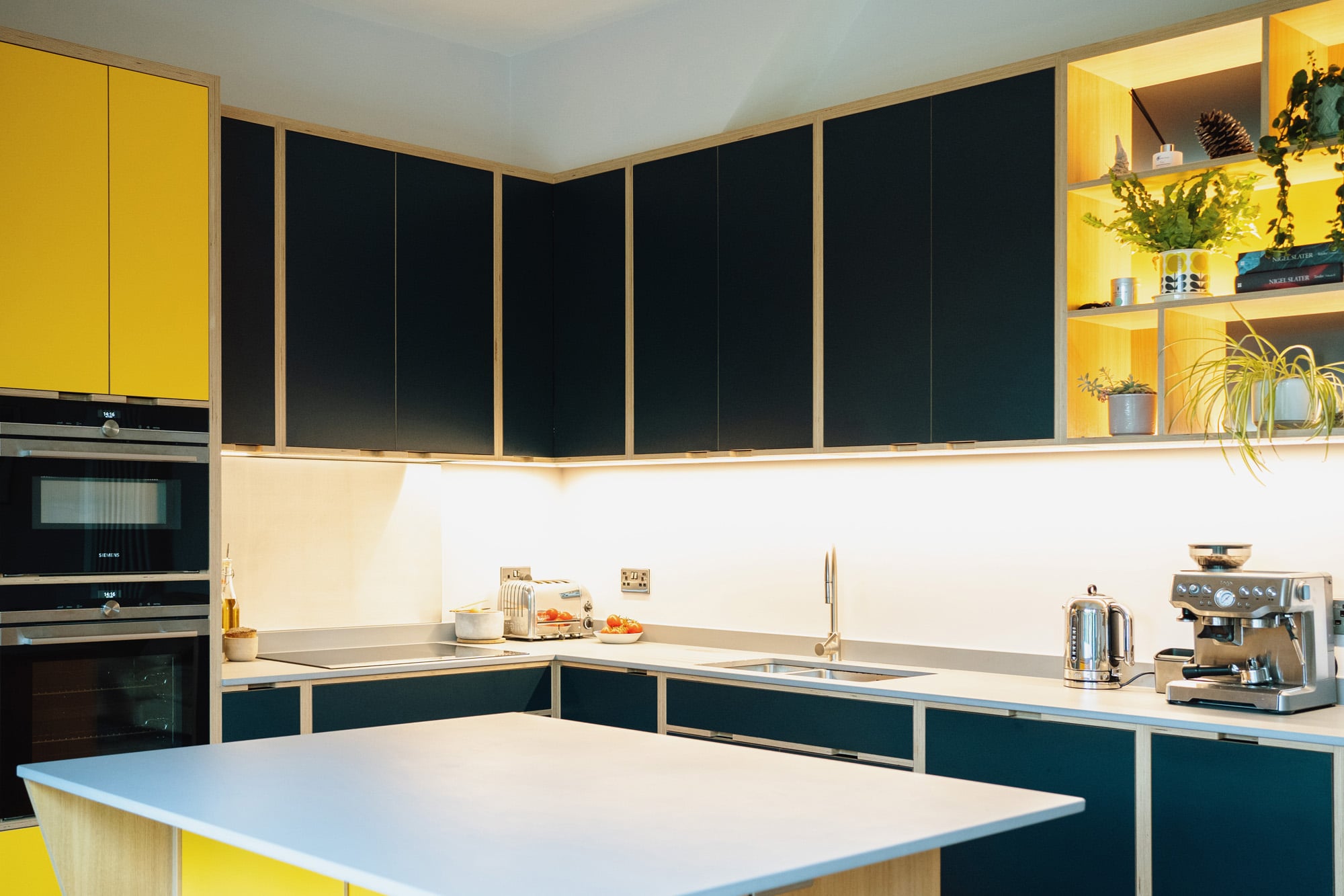 black and yellow modern kitchen with island 