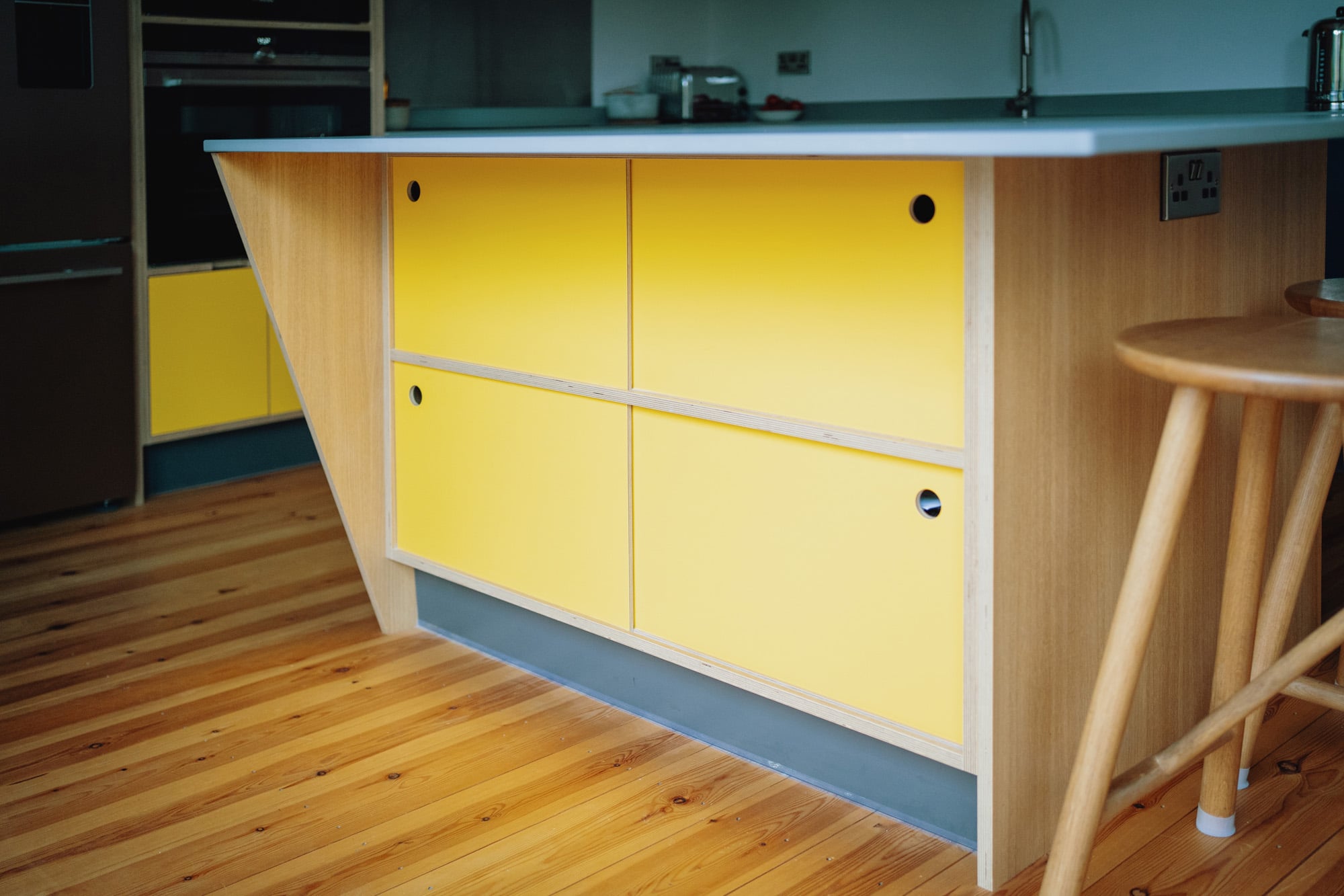 kitchen island with sloping side and sliding door storage