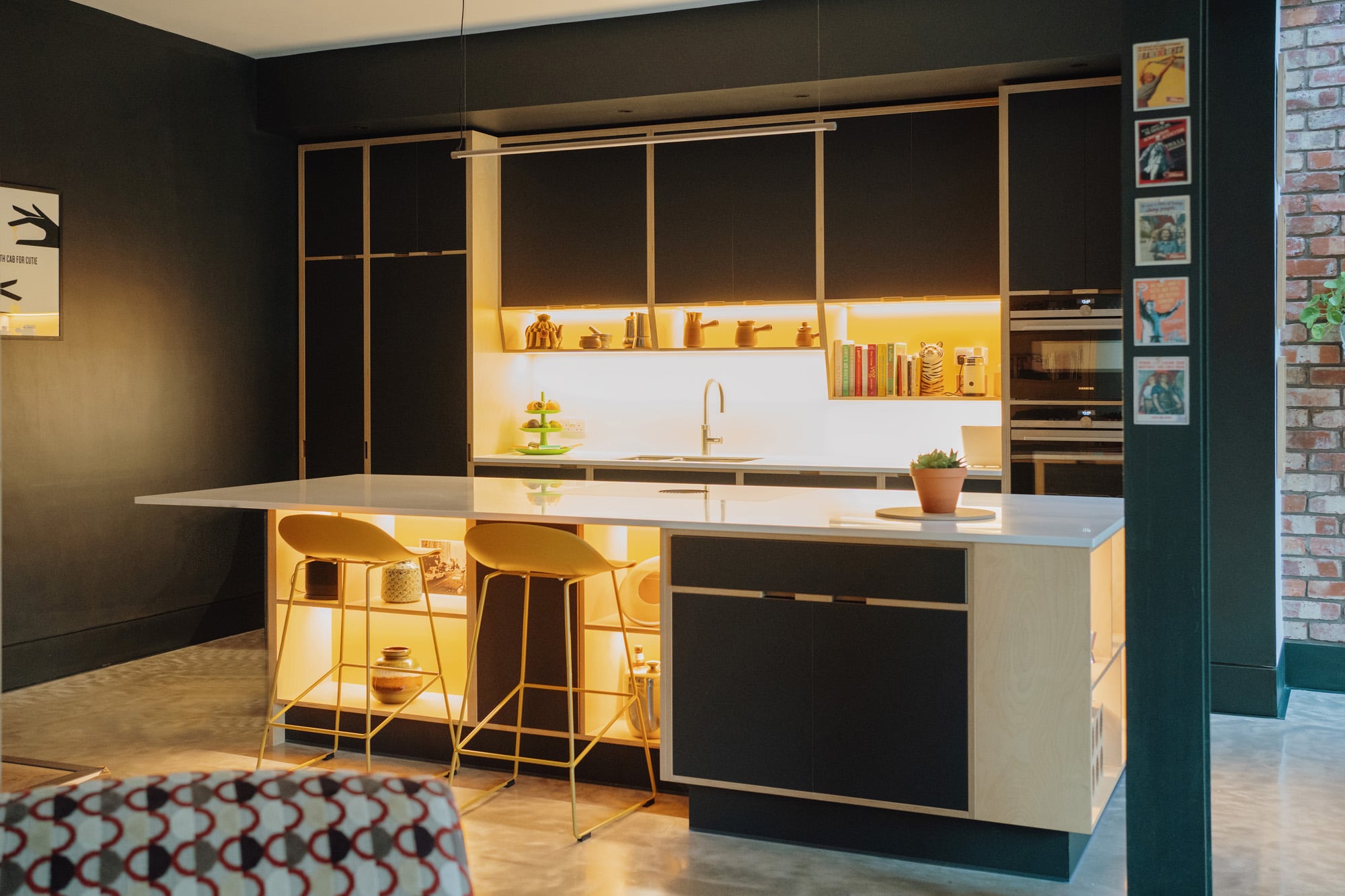 illuminated yellow and black plywood kitchen 
