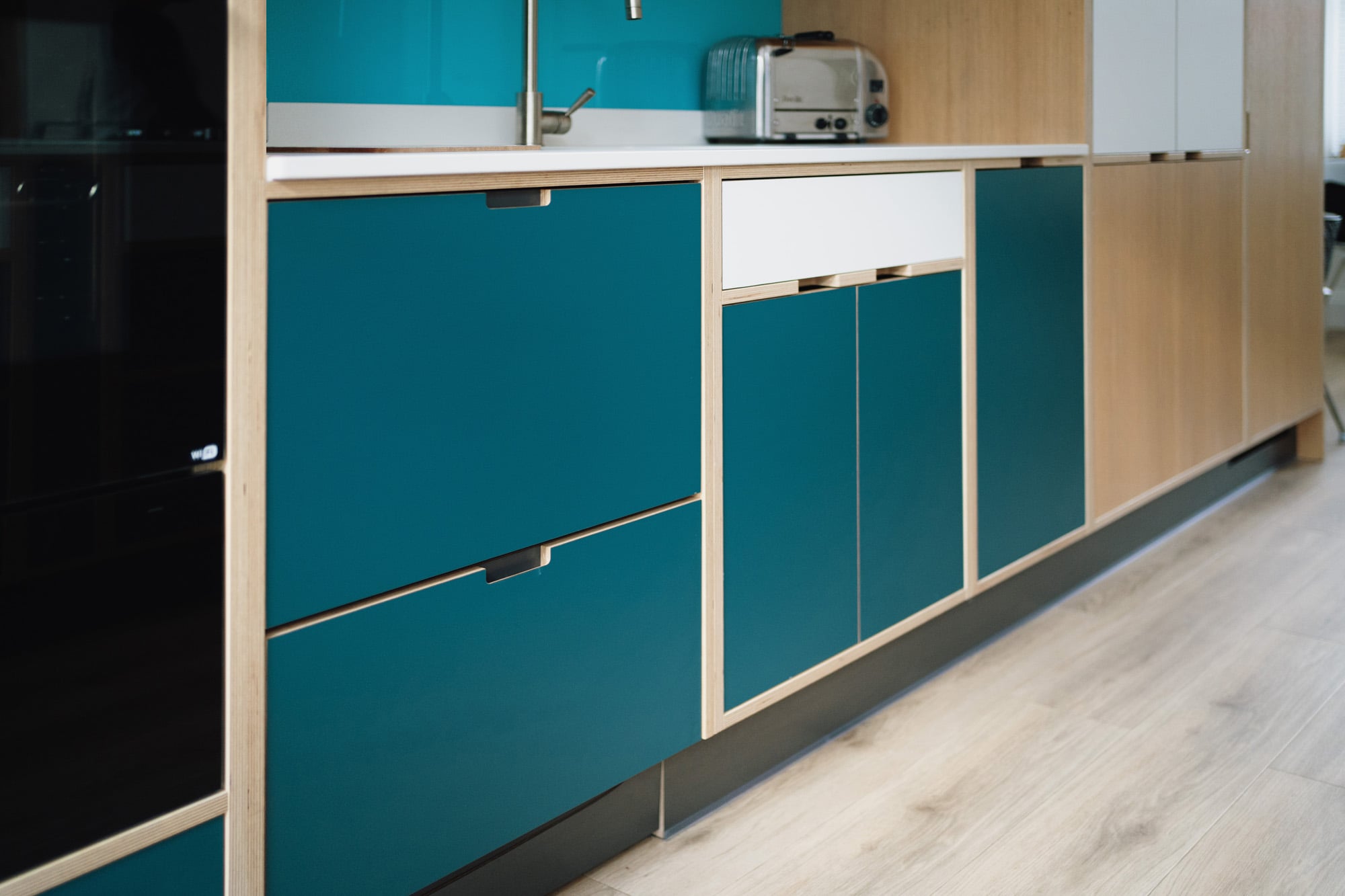 blue and white plywood sink unit