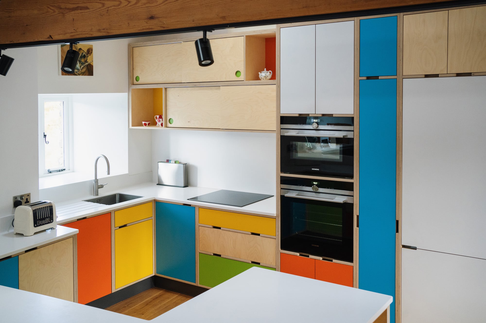 multi coloured plywood kitchen