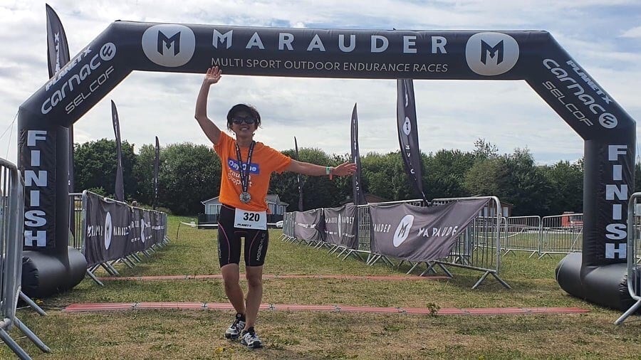Climbing accident recovery woman crosses finish line