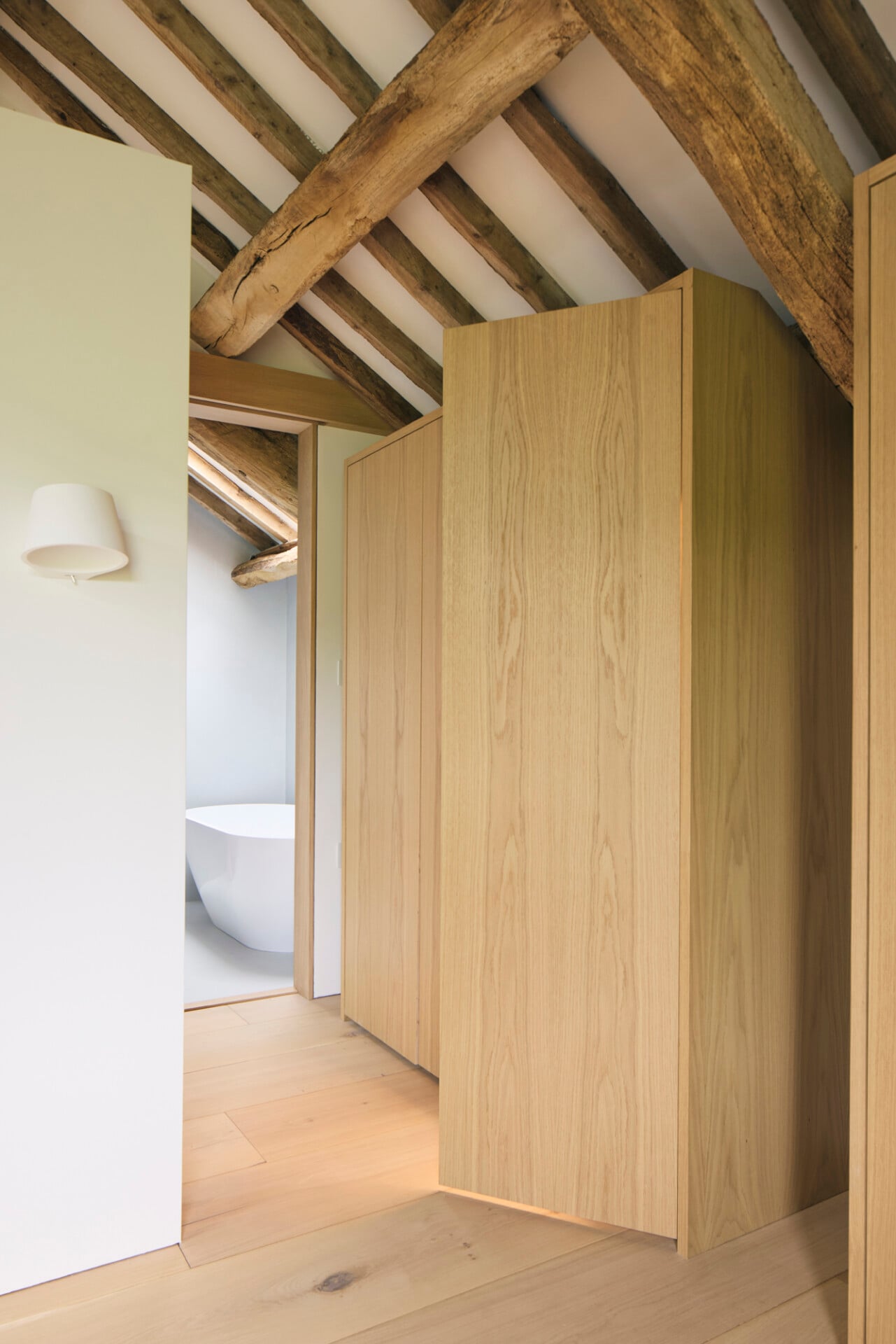 Minimalist oak joinery in bedroom entrance