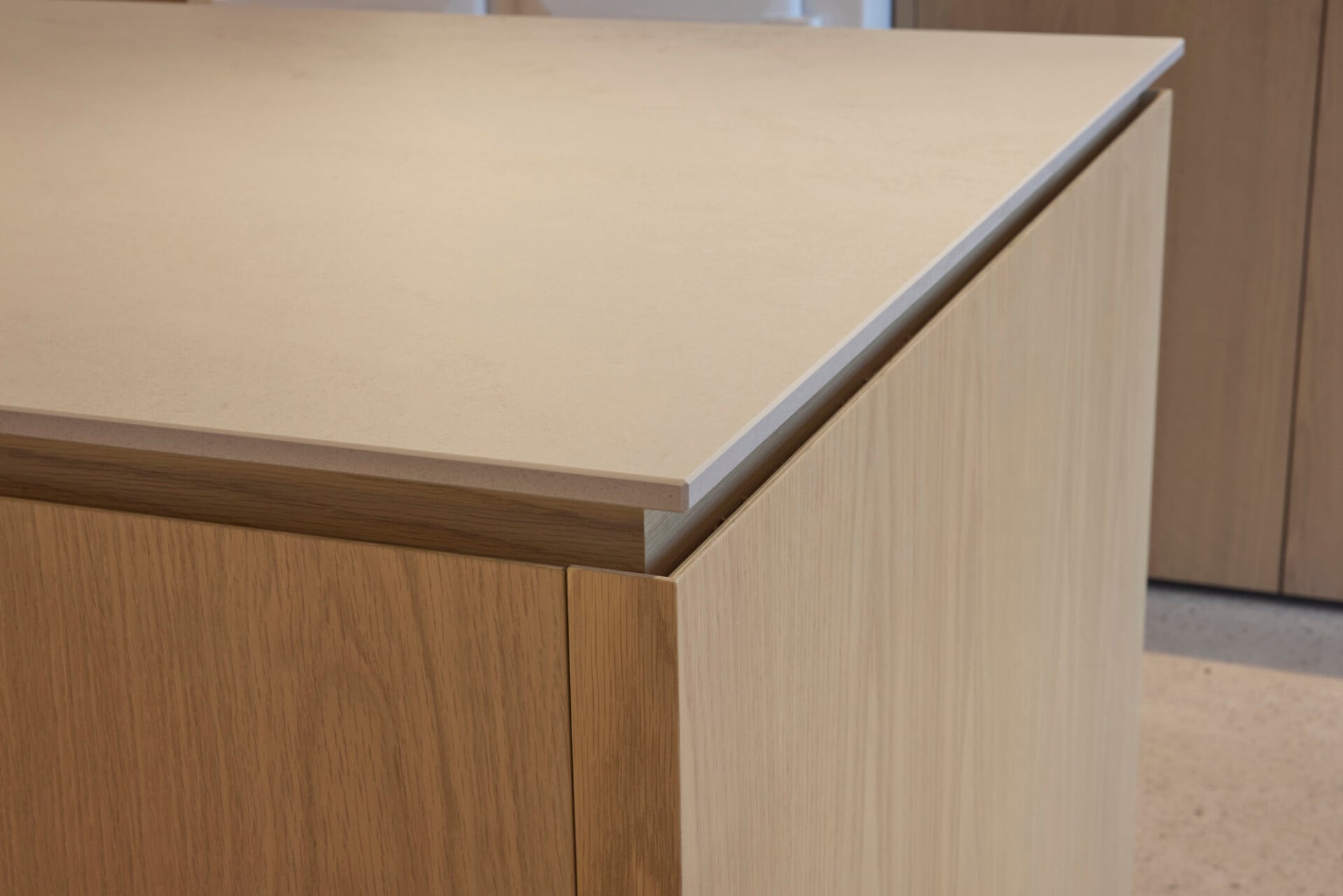 Oak worktop corner in barn kitchen with shadow gap detailing and soft edges