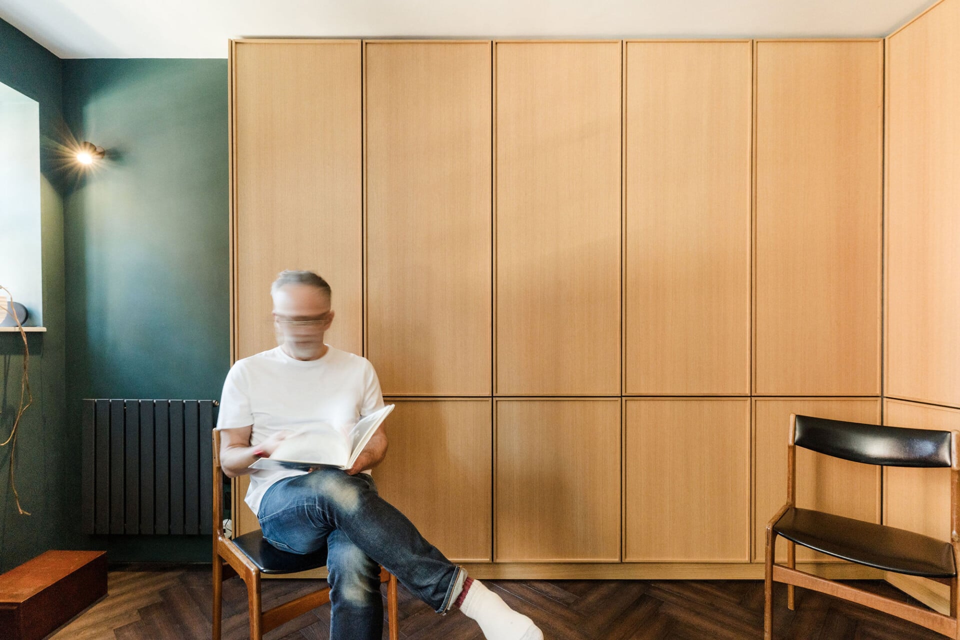 Panelled oak storage wall in a contemporary London flat