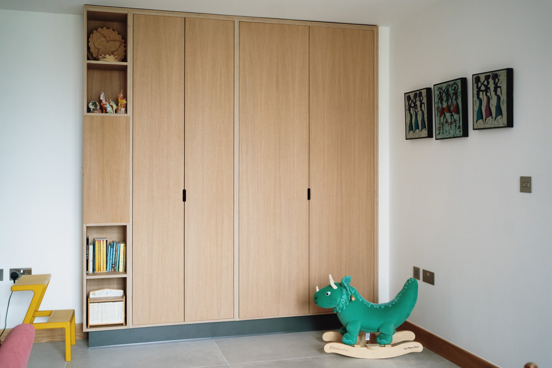Children’s bedroom with full-height plywood wardrobes